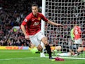 Robin van Persie celebrates scoring for Manchester United against Aston Villa on April 22, 2013