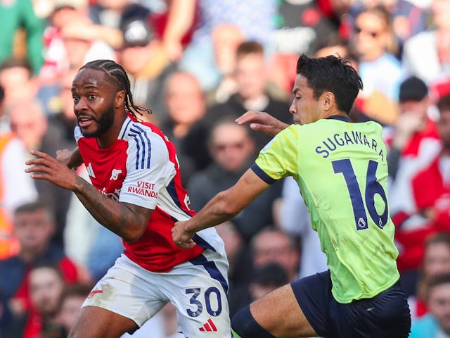 Arsenal's Raheem Sterling in action with Southampton's Yukinari Sugawara on October 5, 2024