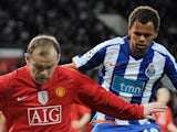 Manchester United's Wayne Rooney in action with Porto's Rolando on April 7, 2009