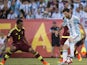 Argentina's Lionel Messi and Venezuela's Arquimedes Figuera in action on June 19, 2016