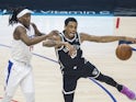  Terance Mann and Nic Claxton in action for Clippers and Nets respectively on October 7, 2024