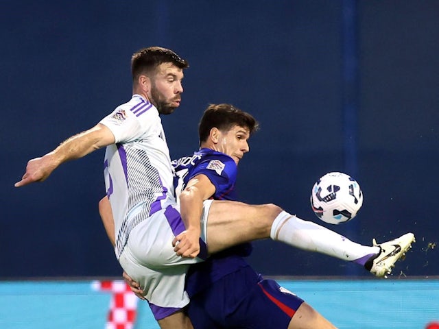 Scotland's Grant Hanley and Croatia's Igor Matanovic battle for the ball during their side's UEFA Nations League Group A1 match on October 12, 2024