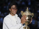 Rafael Nadal poses with the trophy after winning the Wimbledon final in 2008