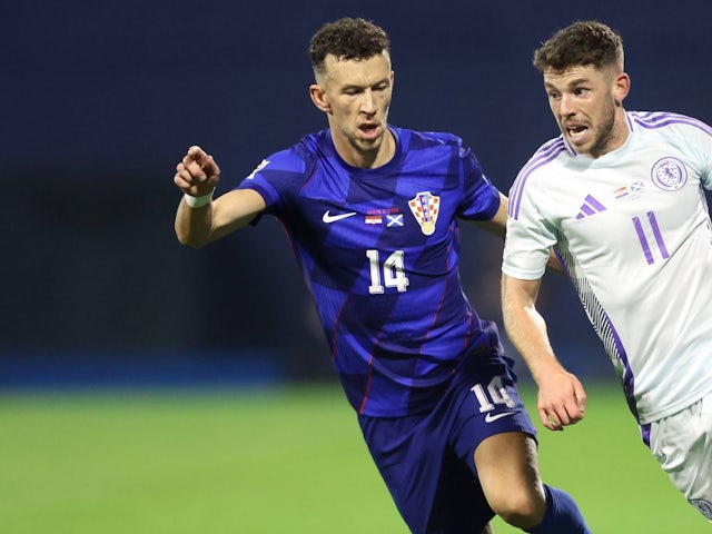 Scotland's Ryan Christie runs with the ball under pressure from Croatia's Ivan Perisic during the UEFA Nations League match on October 12, 2024.