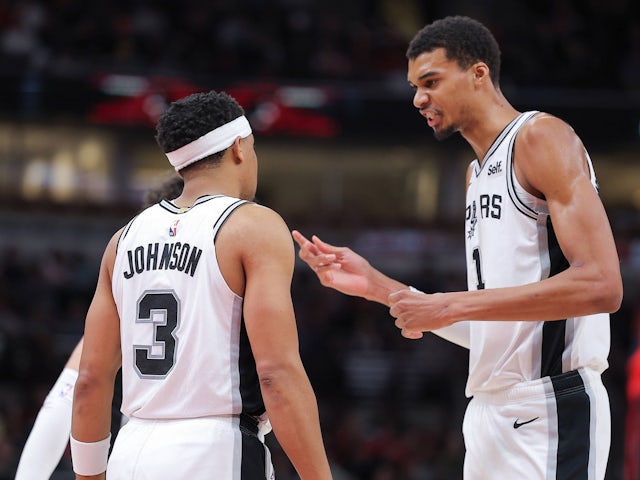 Victor Wembanyama 1 of the San Antonio Spurs chats with Keldon Johnson  on October 5, 2024