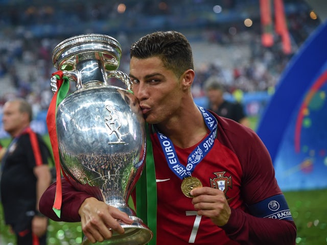 Cristiano Ronaldo celebrates with the Euro 2016 trophy