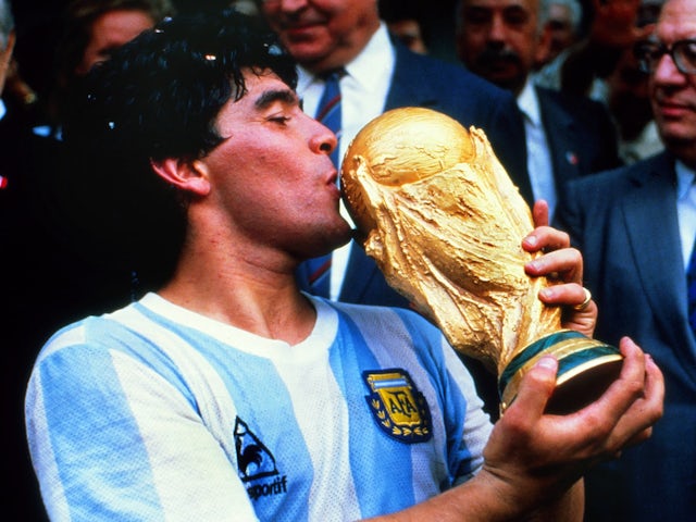 Argentina's Diego Maradona celebrates with the 1986 World Cup trophy