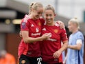 Manchester United Women's Maya Le Tissier celebrates with Millie Turner on October 13, 2024