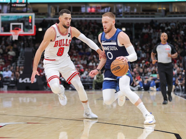 Chicago Bulls guard Zach LaVine guards Minnesota Timberwolves guard Donte DiVincenzo during the first half of a preseason game on October 17, 2024