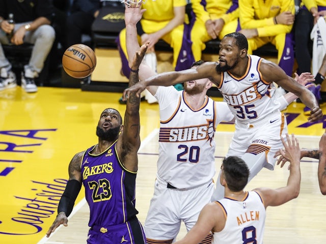 Kevin Durant of the Phoenix Suns blocks a shot by LeBron James of the Los Angeles Lakers on January 11, 2024