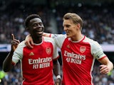 Arsenal's Bukayo Saka and Martin Odegaard celebrate on April 28, 2024