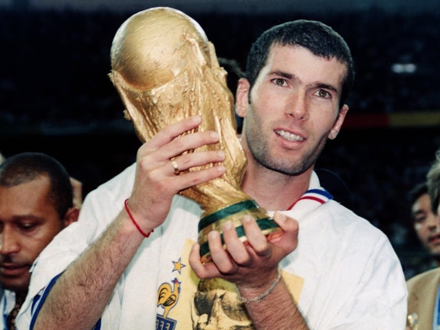 Zinedine Zidane celebrates with the 1998 World Cup trophy