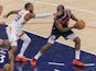  James Harden of the Los Angeles Clippers is defended by Monte Morris of the Phoenix Suns on October 25, 2024