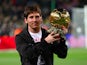 Barcelona's Lionel Messi poses with the men's Ballon d'Or trophy on December 16, 2009