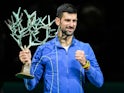 Novak Djokovic poses with the trophy after winning the Paris Masters on November 5, 2023