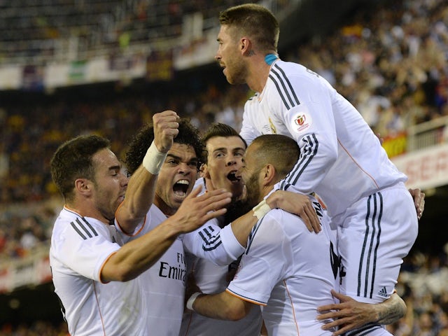 Real Madrid's Gareth Bale celebrates scoring with teammates on April 16, 2014