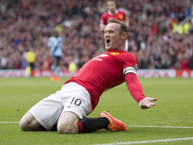 Wayne Rooney celebrates scoring for Manchester United on September 27, 2014