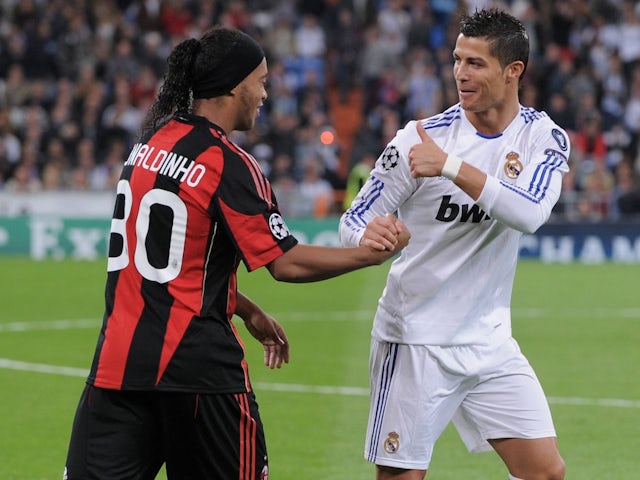 AC Milan's Ronaldinho and Real Madrid's Cristiano Ronaldo on October 19, 2010