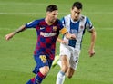 Barcelona's Lionel Messi and Espanyol's Marc Roca on July 9, 2020