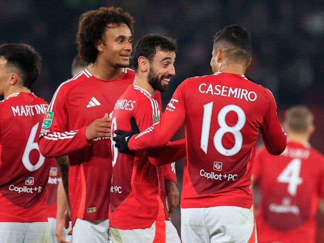 Manchester United's Bruno Fernandes celebrates with Joshua Zirkzee and Casemiro after scoring on October 30, 2024