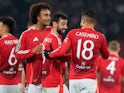 Manchester United's Bruno Fernandes celebrates with Joshua Zirkzee and Casemiro after scoring on October 30, 2024