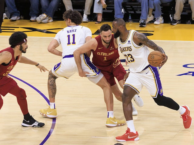  LeBron James 23 of the Los Angeles Lakers is defended by Max Strus 1 of the Cleveland Cavaliers on October 29, 2024