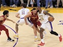  LeBron James 23 of the Los Angeles Lakers is defended by Max Strus 1 of the Cleveland Cavaliers on October 29, 2024