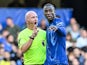 Referee Simon Hooper talks to Chelsea's Nicolas Jackson on October 27, 2024