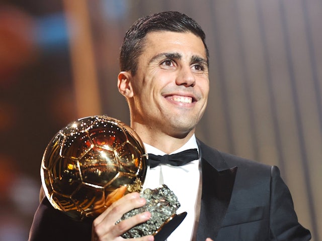 Manchester City's Rodri poses with the Ballon d'Or trophy on October 28, 2024