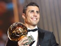 Manchester City's Rodri poses with the Ballon d'Or trophy on October 28, 2024