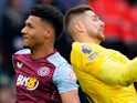 Tottenham Hotspur's Guglielmo Vicario and Aston Villa's Ollie Watkins clash on March 31, 2024