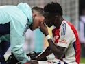 Arsenal's Bukayo Saka receives treatment for an injury on November 10, 2024