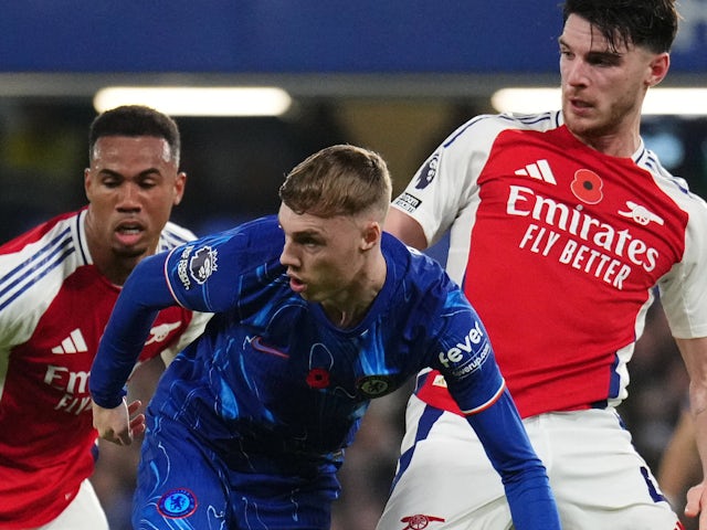 Chelsea's Cole Palmer in action with Arsenal's Declan Rice and Gabriel Magalhaes on November 10, 2024