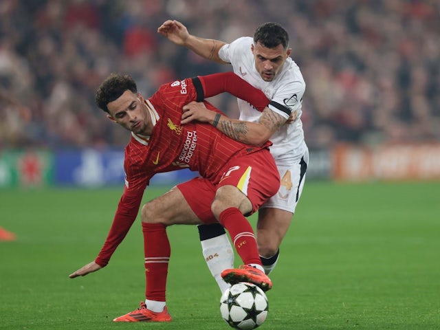 Curtis Jones of Liverpool battles Granit Xhaka of Bayer Leverkusen during their side's clash, on November 5, 2024