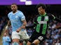 Manchester City's Kyle Walker in action with Brighton & Hove Albion's Kaoru Mitoma on October 21, 2023