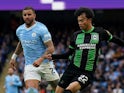 Manchester City's Kyle Walker in action with Brighton & Hove Albion's Kaoru Mitoma on October 21, 2023