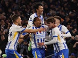 Brighton & Hove Albion's Matt O'Riley and Joao Pedro celebrate with teammates on November 9, 2024