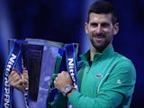 Novak Djokovic poses with the trophy after winning the ATP Finals on November 19, 2023