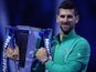 Novak Djokovic poses with the trophy after winning the ATP Finals on November 19, 2023