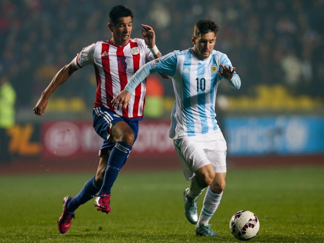 Argentina's Lionel Messi and Paraguay's Victor Caceres on June 30, 2015