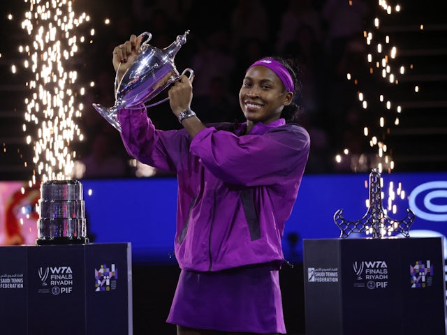 Coco Gauff poses with the trophy after winning the WTA Finals on November 11, 2024