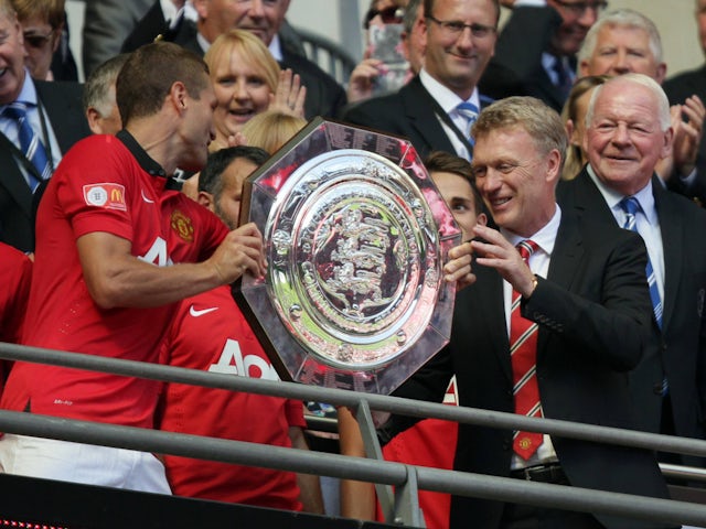 Manchester United manager David Moyes and captain Nemanja Vidic with the Community Shield on August 11, 2013