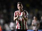 Luke Young of Cheltenham Town applauds the fans after his side's EFL Cup match against Plymouth Argyle, on 14 August 2024