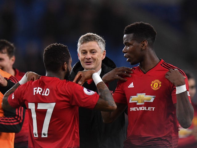 Manchester United manager Ole Gunnar Solskjaer with Fred and Paul Pogba on December 22, 2018