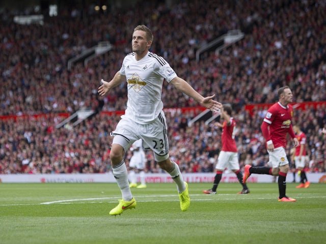 Swansea City's Gylfi Sigurdsson celebrates on August 16, 2015