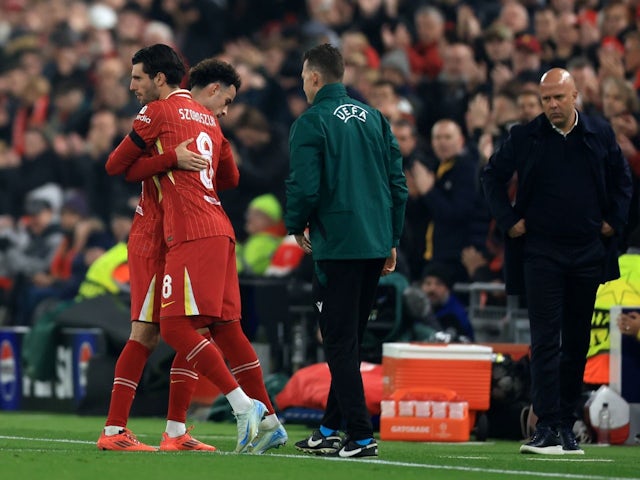 Curtis Jones of Liverpool goes off for Dominik Szoboszlai during their side's UEFA Champions League match against Bayer Leverkusen, on November 5, 2024