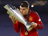 Spain's Alvaro Morata celebrates with the UEFA Nations League trophy on June 18, 2023