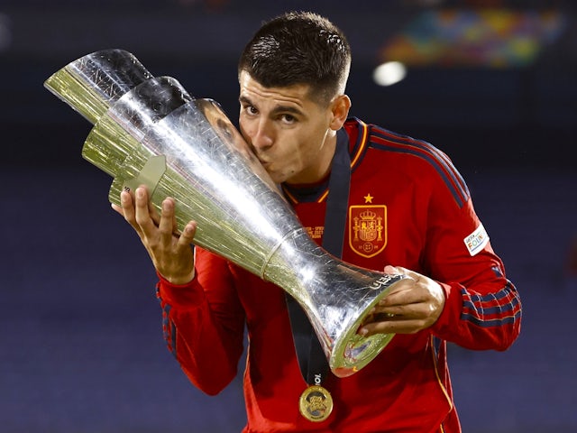 Spain's Alvaro Morata celebrates with the UEFA Nations League trophy on June 18, 2023