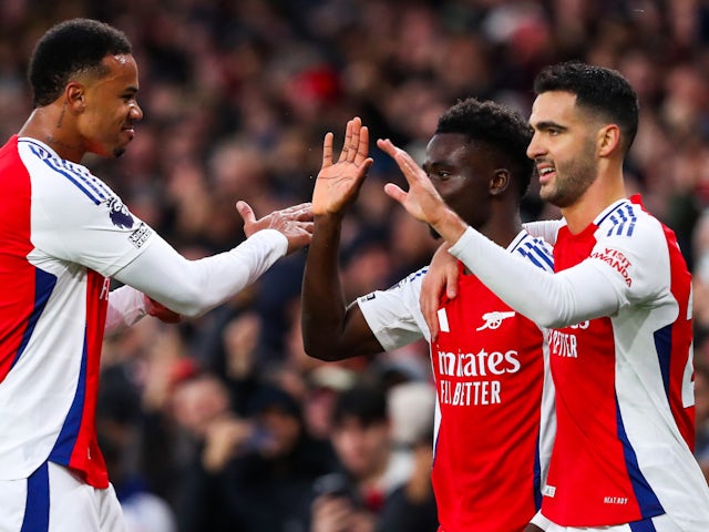 Arsenal's Bukayo Saka, Mikel Merino and Gabriel Magalhaes celebrate on November 23, 2024