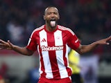 Olympiacos forward Ayoub El Kaabi celebrates scoring on November 24, 2024